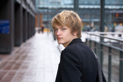 photo of young man departing sadly