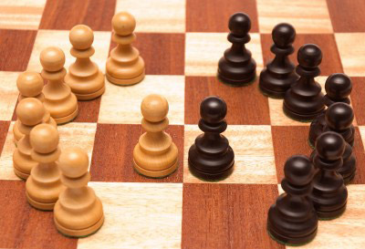 photo of chesspieces opposing sides